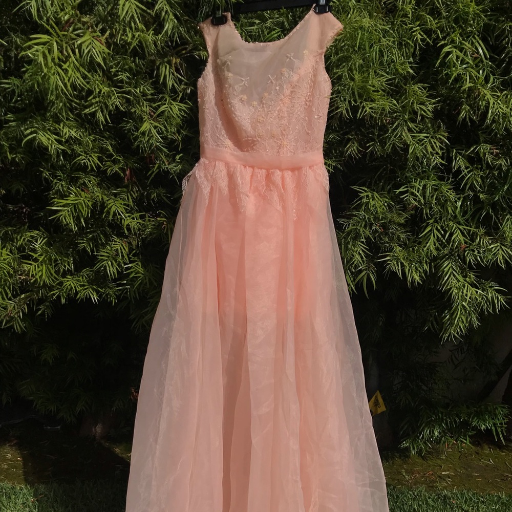 Long prom like dress. Peach in color. Never worn